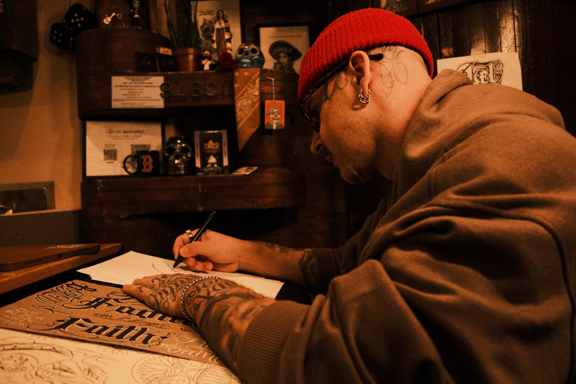 Abel drawing a custom tattoo design